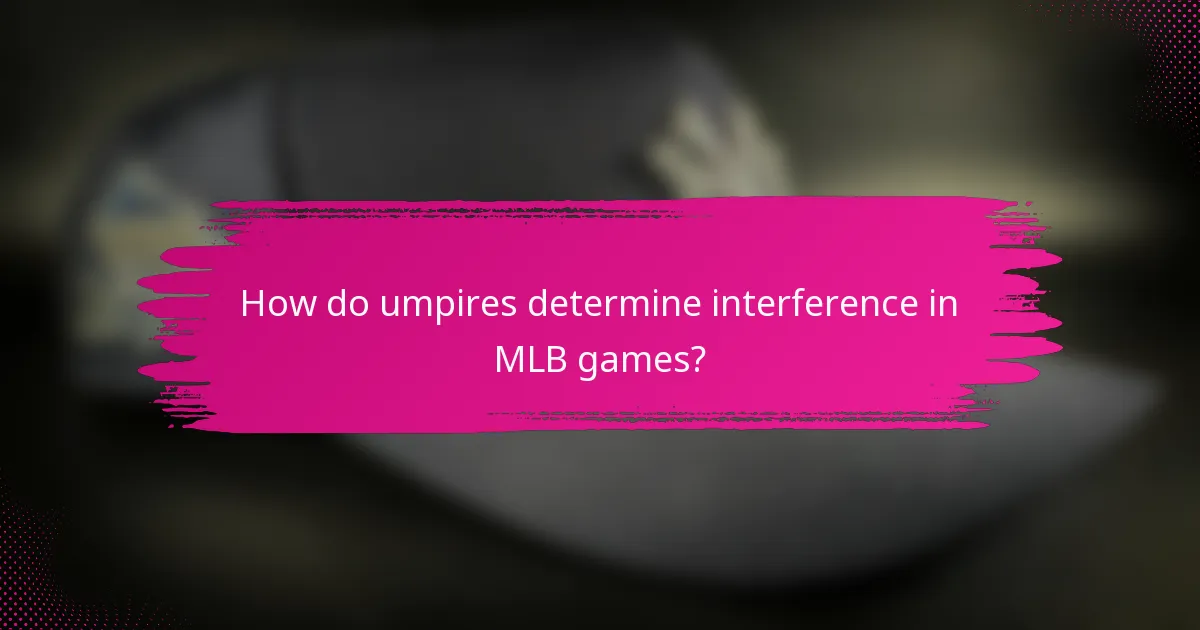 How do umpires determine interference in MLB games?